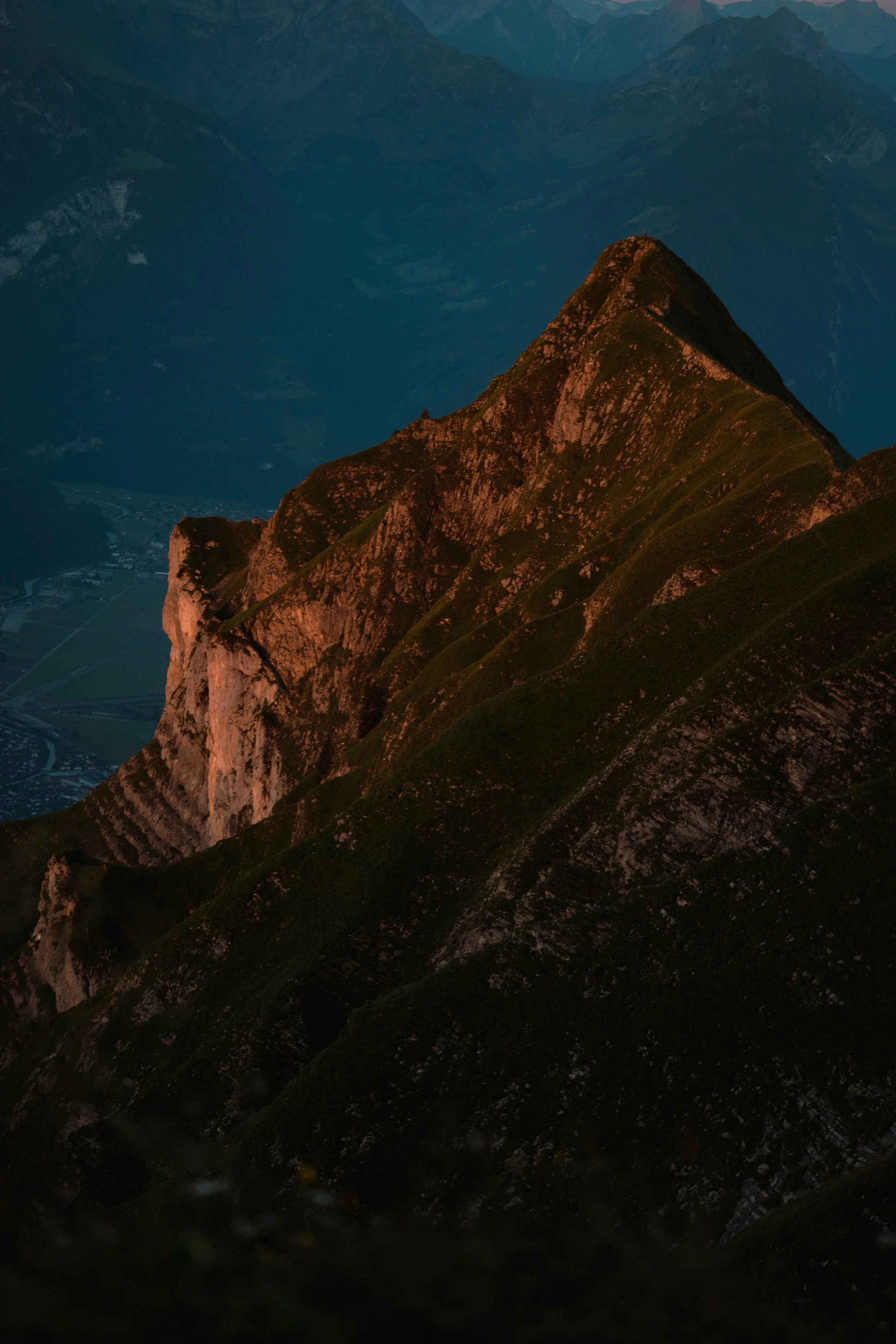 Mountain peak lit by golden hour sun.